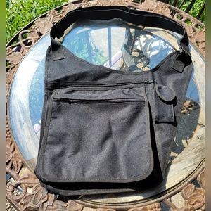 Side carry utility crossover bag. Great for traveling.